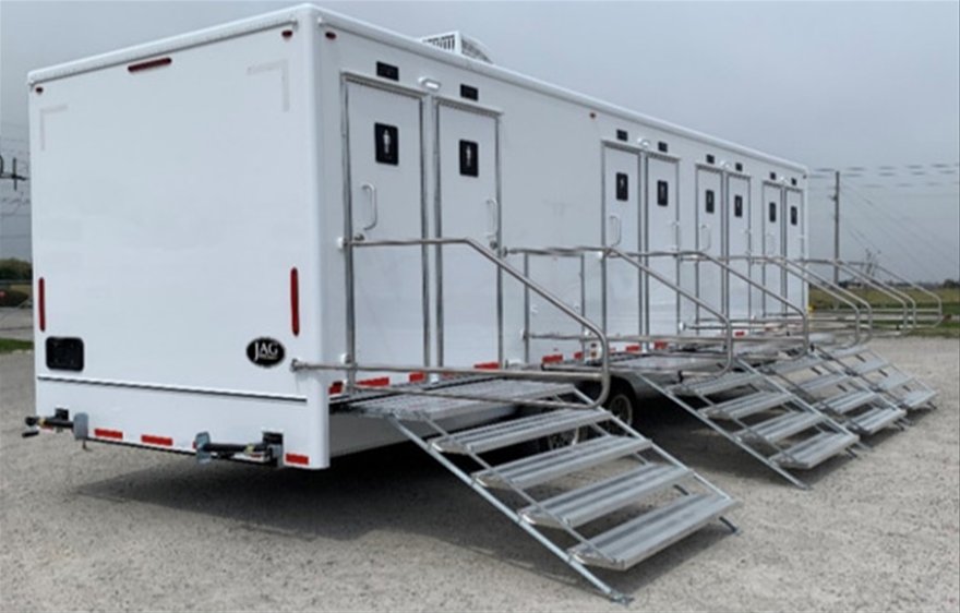 White multi-stall shower trailer with fold-down aluminum steps